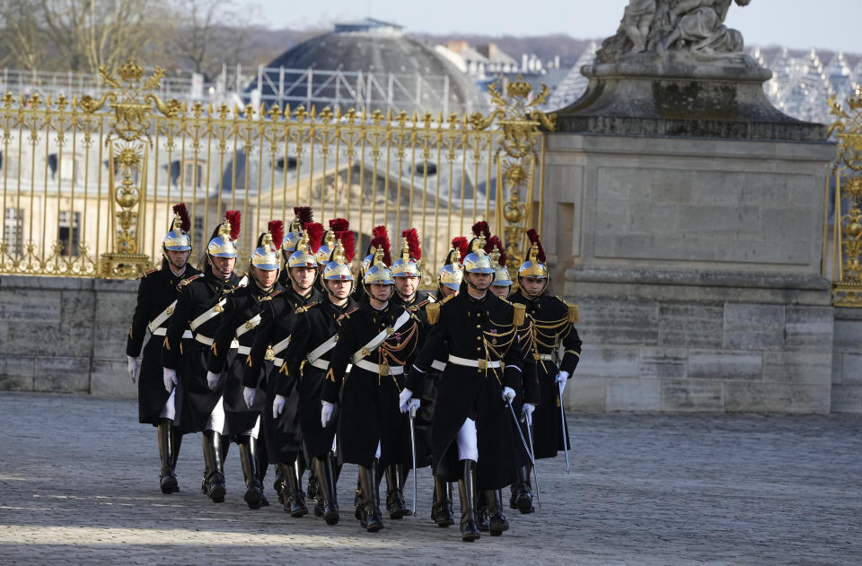 French Republican guards march, prior to leaders arrivals, during an EU summit at the Chateau de Versailles, in Versailles, west of Paris, Thursday, March 10, 2022. With European nations united in backing Ukraine's resistance with unprecedented economic sanctions, three main topics now dominate the agenda: Ukraine's application for fast-track EU membership; how to wean the bloc off its Russian energy dependency; and bolstering the region's defense capabilities. (AP Photo/Michel Euler)