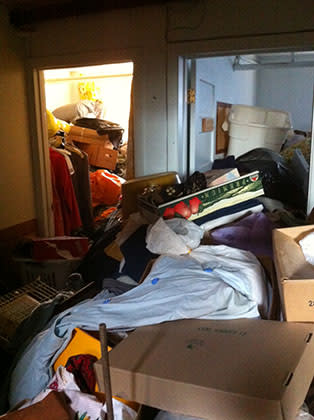 Boxes, clothes, and bins take over rooms and hallways