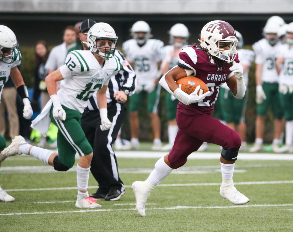 Caravel's Craig Miller gets past the Archmere defense for the only score of the first half in the DIAA Class 2A championship at Delaware Stadium, Saturday, Dec. 2, 2023.