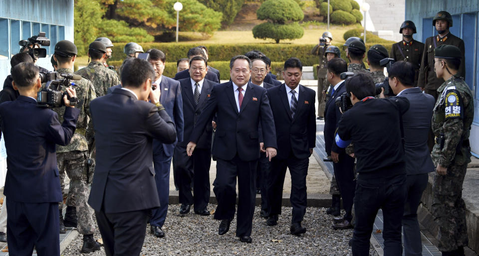 The head of the North Korean delegation Ri Son Gwon, center, arrives at the South side for the meeting with South Korea at Panmunjom in the Demilitarized Zone, South Korea, Monday, Oct. 15, 2018. The rival Koreas are holding high-level talks Monday to discuss further engagement amid a global diplomatic push to resolve the nuclear standoff with North Korea. (Korea Pool/Yonhap via AP)