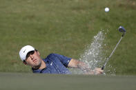 Scottie Scheffler hits out of a bunker on the second hole during the final round of the Houston Open golf tournament Sunday, Nov. 14, 2021, in Houston. (AP Photo/Michael Wyke)