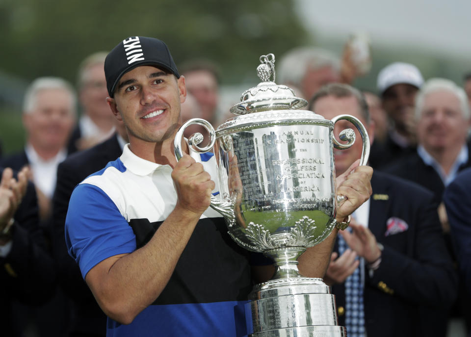 Brooks Koepka holds up the Wanamaker Trophy after winning the PGA Championship golf tournament, Sunday, May 19, 2019, at Bethpage Black in Farmingdale, N.Y. (AP Photo/Julio Cortez)