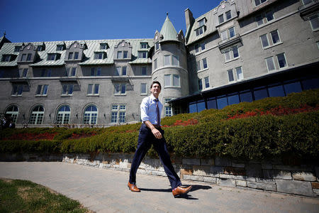 Canada's Prime Minister Justin Trudeau walks outside the Manoir Richelieu, site of the upcoming G7 leaders' summit in Quebec's Charlevoix region, before the start of an interview with Reuters in La Malbaie, Quebec, Canada, May 24, 2018. REUTERS/Chris Wattie