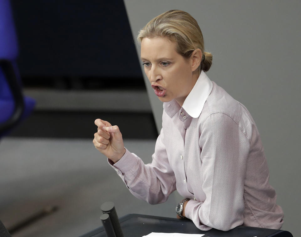 FILE -- In this Wednesday, May 16, 2018 photo Alice Weidel, right, co-faction leader of the Alternative for Germany party, delivers a speech during a meeting of the German federal parliament, Bundestag, at the Reichstag building in Berlin, Germany. The co-leader of a far-right party in Germany is defending herself against suggestions she might have accepted campaign donations that were illegal. (AP Photo/Michael Sohn, file)