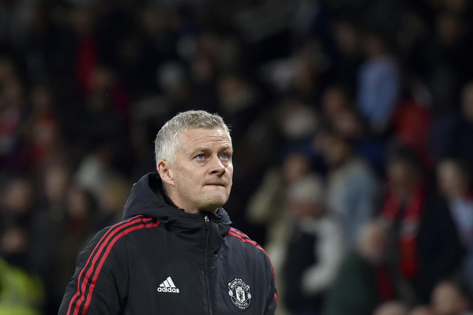 Manchester United's manager Ole Gunnar Solskjaer leaves the field at the end of the English Premier League soccer match between Manchester United and Liverpool at Old Trafford in Manchester, England, Sunday, Oct. 24, 2021. Liverpool won 5-0. (AP Photo/Rui Vieira)