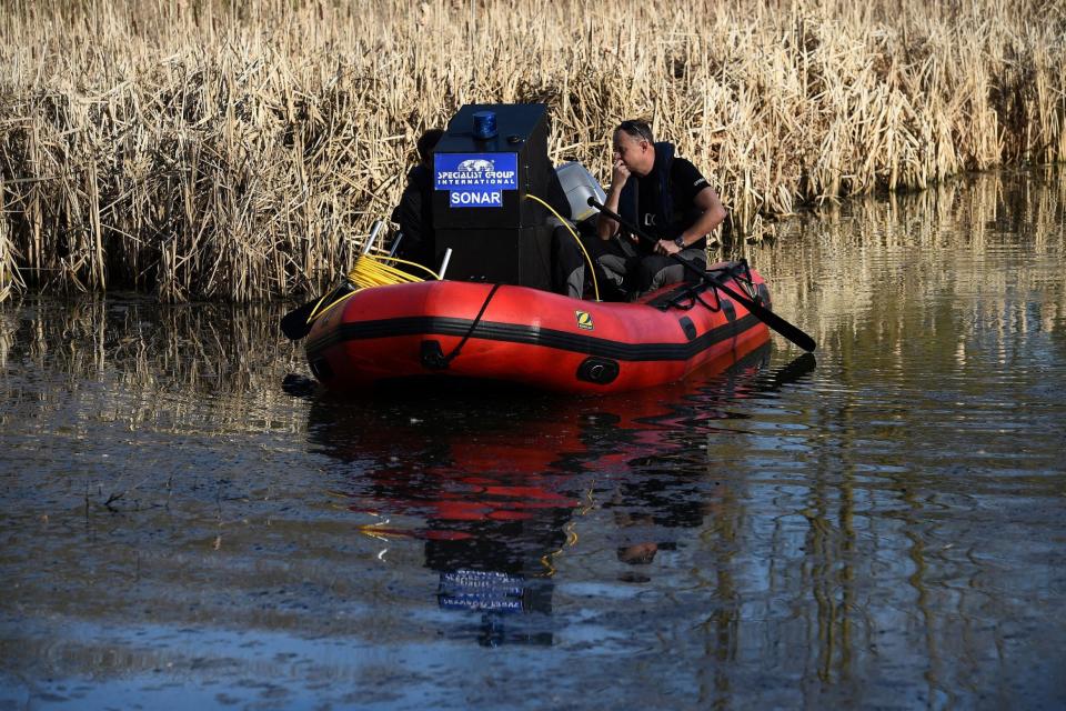 An underwater search rescue team began work on the lakes on Friday (PA)