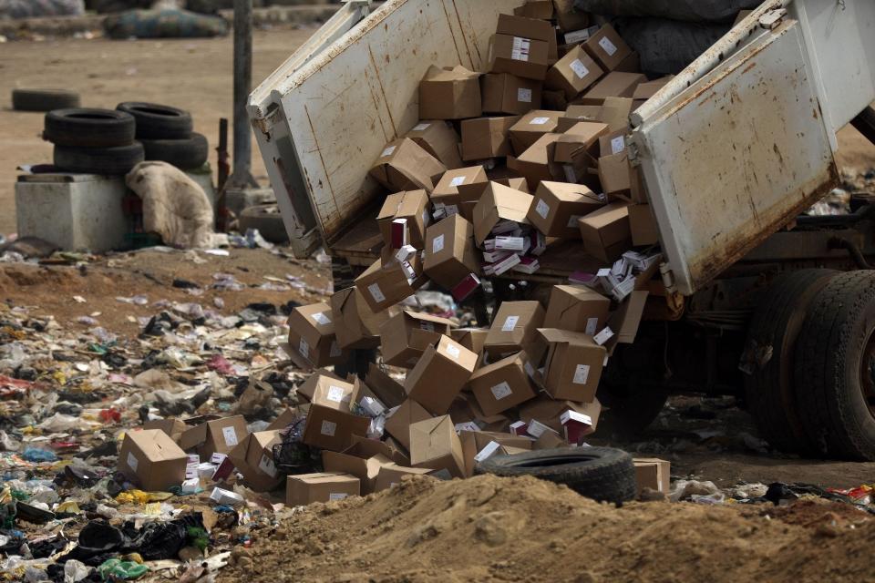 boxes of expired covid 19 vaccine dumped into garbage pit