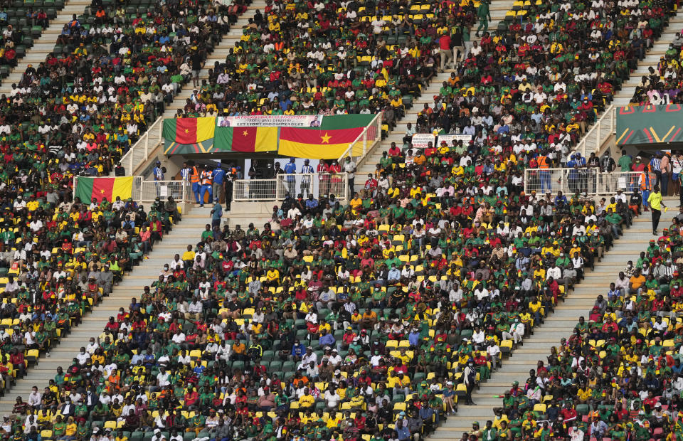 Soccer fans watch the African Cup of Nations 2022 group A soccer match between Cape Verde and Cameron at the Olembe stadium in Yaounde, Cameroon, Monday, Jan. 17, 2022. (AP Photo/Themba Hadebe)