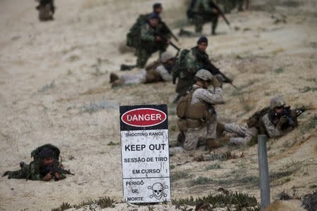 NATO soldiers attend a NATO military exercise at Raposa beach, near Setubal, Portugal October 20, 2015. REUTERS/Rafael Marchante