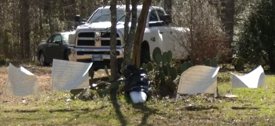 The fake body was taken down and signs were put up explaining why it was in the tree (WCBD-TV)