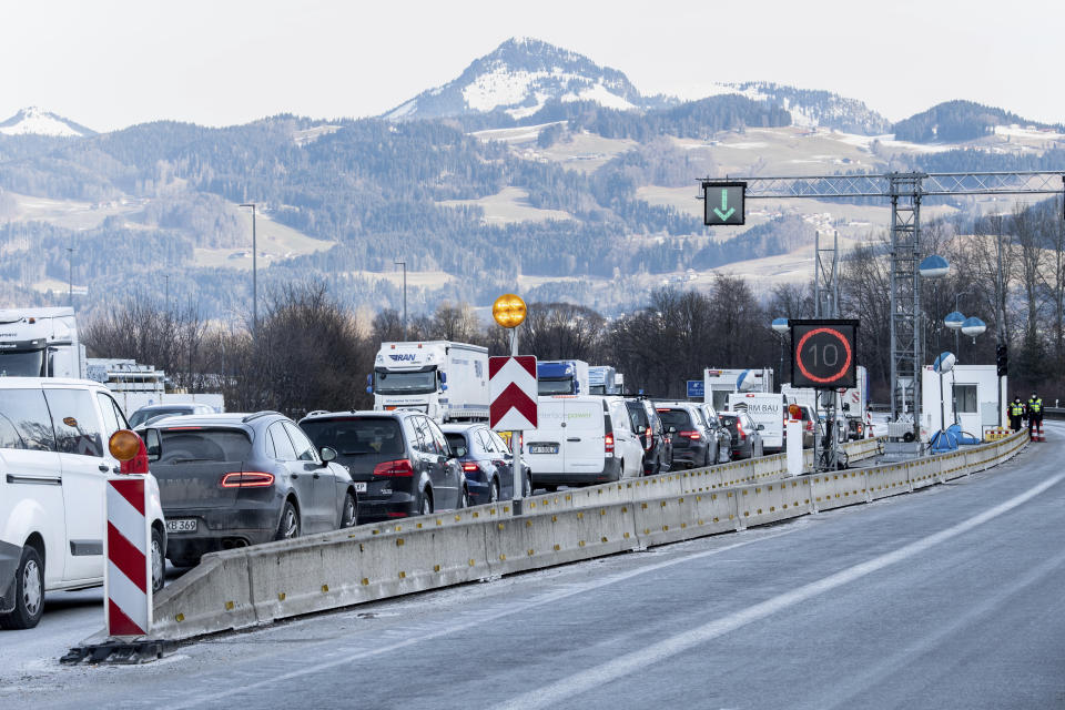 Cars coming from Austria stuck in traffic at a border checkpoint on the A93 motorway near Kiefersfelden, Germany, Monday, Feb. 15, 2021. The tightened German entry rules at the border with the Austrian state of Tyrol to protect against the spread of the coronavirus came into force on Sunday night. (Matthias Balk/dpa via AP)