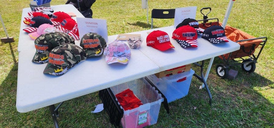 The Mid Florida Event Center serves as precinct March 19, 2024, for Tuesday's Presidential Preference Primary in Port St. Lucie. St. Lucie County Republican officials are outside with merchandise for former President Donald Trump, who is the only Republican candidate still in the race.