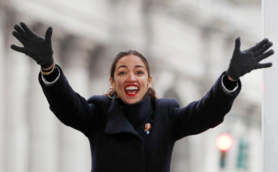 U.S. Rep. Alexandria Ocasio-Cortez, (D-New York) waves to the crowd at the Women's Unity Rally in New York on Jan. 19. On Saturday, she canceled an upcoming appearance in Park City, Utah, at the Sundance Film Festival.