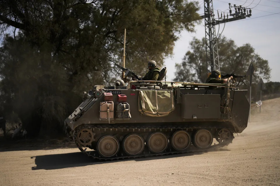 Soldiers drive a militar vehicle near the border between Israel and Gaza Strip in Israel, Saturday, Oct. 21, 2023. (AP Photo/Francisco Seco)