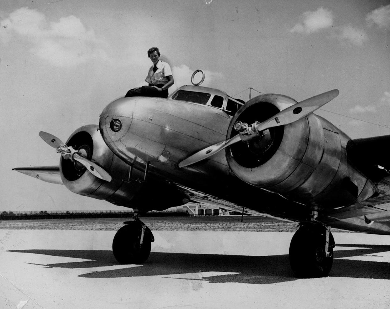 earhart sitting atop plane