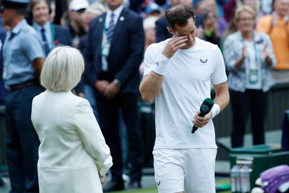 Andy Murray becomes emotional during a ceremony emceed by former BBC presenter Sue Barker honoring his Wimbledon career.