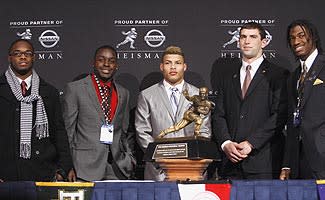 Andrew Luck, fourth from the left, cleaned up his look in time for the Heisman Trophy ceremony in December