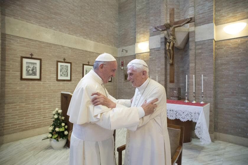 FILE - Pope Francis, left, embraces Emeritus Pope Benedict XVI, at the Vatican, June 28, 2017. Pope Francis on Wednesday, Dec. 28, 2022, said his predecessor, Pope Emeritus Benedict XVI, is "very sick," and he asked the faithful to pray for the retired pontiff so God will comfort him "to the very end." (L'Osservatore Romano/Pool Photo via AP, File)