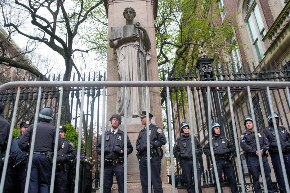 NYPD officers stand guard at Columbia’s main campus. AP