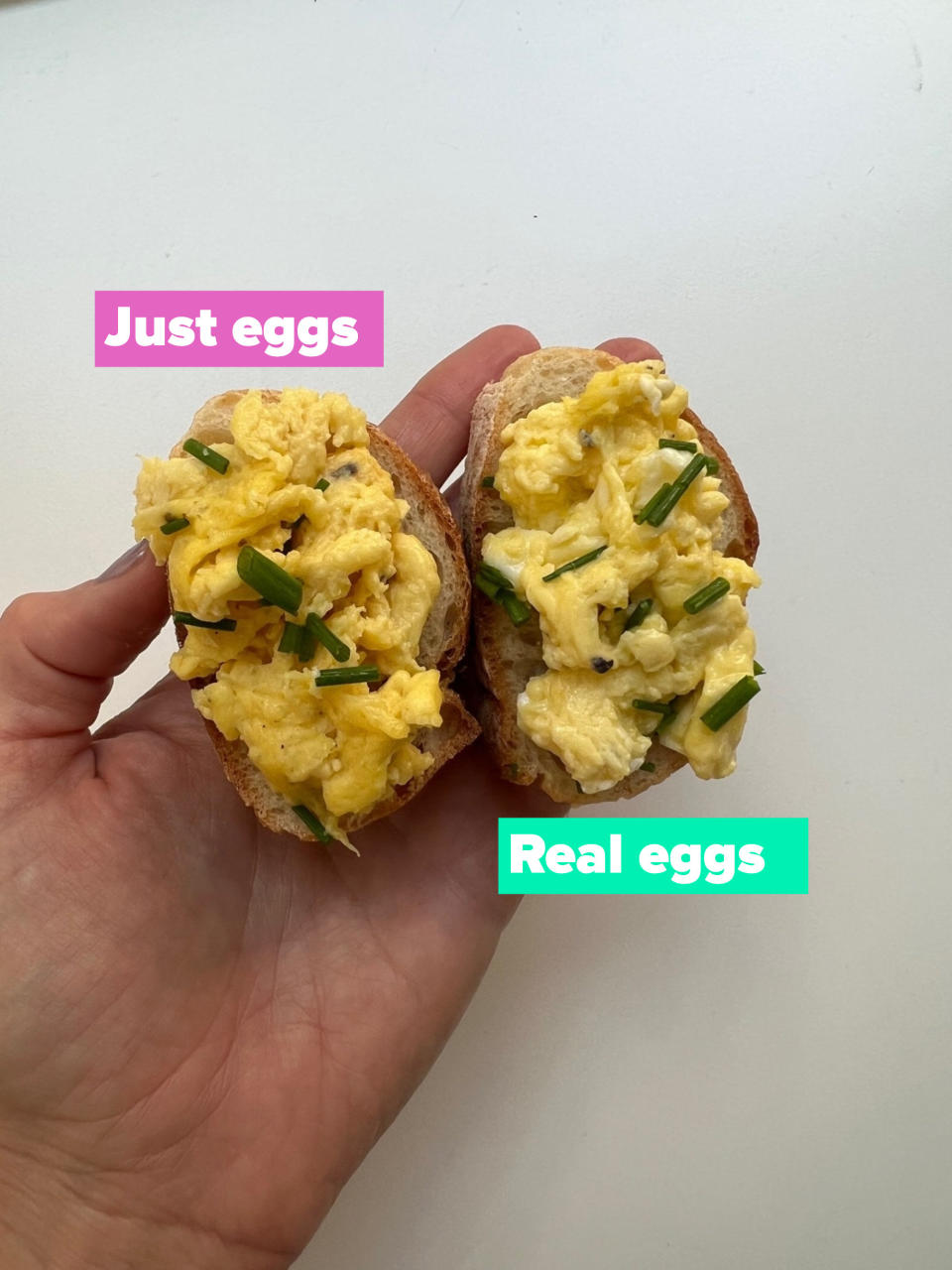 Eggs and plant-based eggs on two pieces of bread.