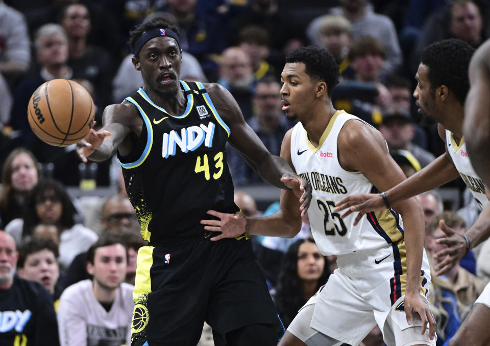 Indiana Pacers forward Pascal Siakam (43) passes the ball away from New Orleans Pelicans guard Trey Murphy III (25) during the second half of an NBA basketball game Wednesday, Feb. 28, 2024, in Indianapolis. (AP Photo/Marc Lebryk)