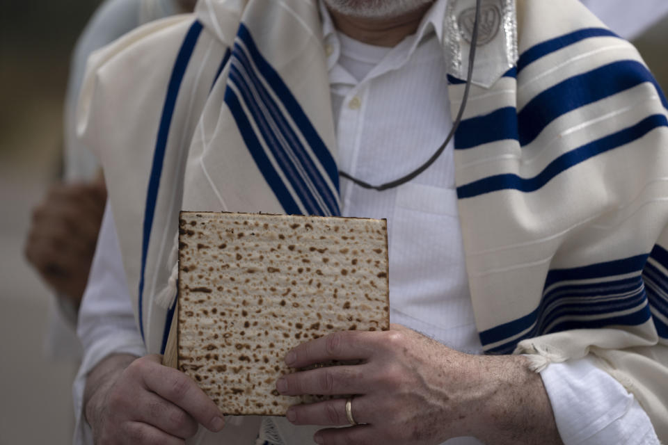 American and Israeli rabbis fromRabbis for Ceasefire hold matzoh for the Jewish holiday of Passover after they marched towards the Erez crossing to the Gaza Strip with food aid for Gaza civilians and to call for a ceasefire, in southern Israel, Friday, April 26, 2024. (AP Photo/Maya Alleruzzo)