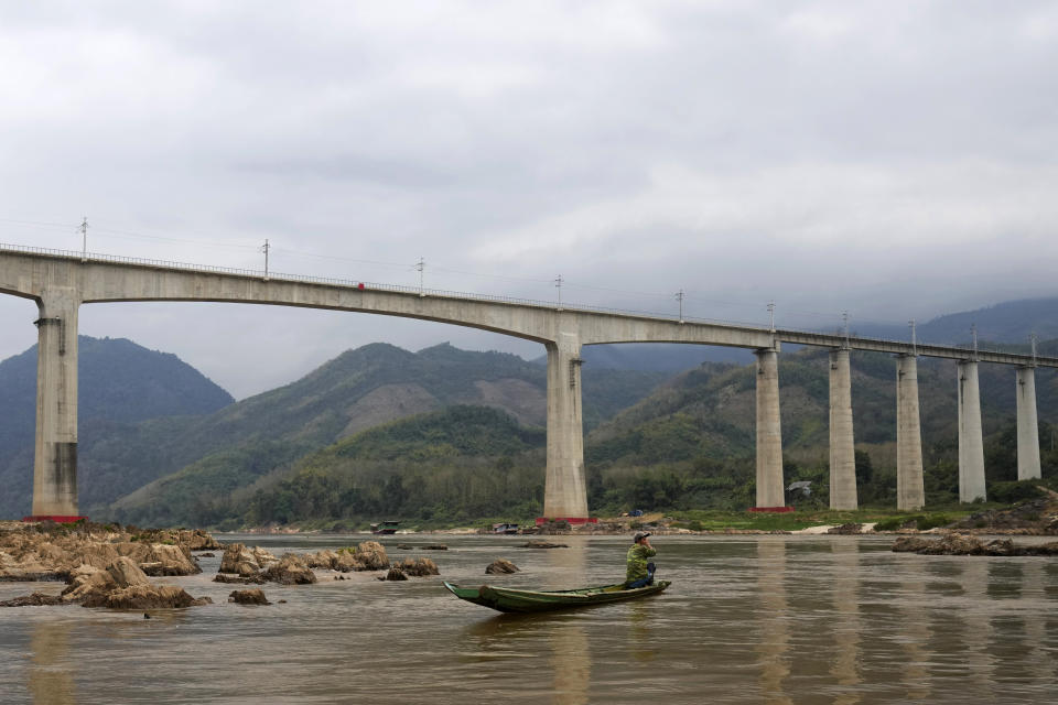 The overpass for the high speed raill system is seen in Mekong river in Luang Prabang, Laos, Sunday, Jan. 28, 2024. Luang Prabang was named a UNESCO World Heritage Site nearly 30 years ago, but a multibillion-dollar dam project is raising questions that could deprive the city of its coveted status and prompting broader concerns the Mekong River could be ruined by multiple dams that are being planned.(AP Photo/Sakchai Lalit)