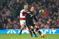 <p>Arsenal’s Kieran Gibbs (left) and Hull City’s Lazar Markovic (right) battle for the ball </p>