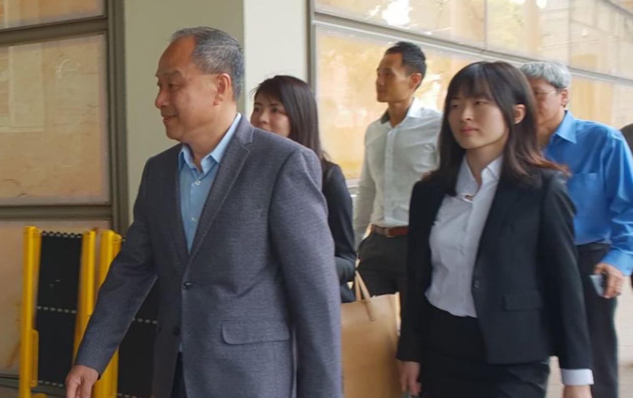 Former Workers’ Party chief Low Thia Khiang (left) entering the Supreme Court building on Friday morning (5 October 2018). (Photo: Yahoo News Singapore/Wan Ting Koh)