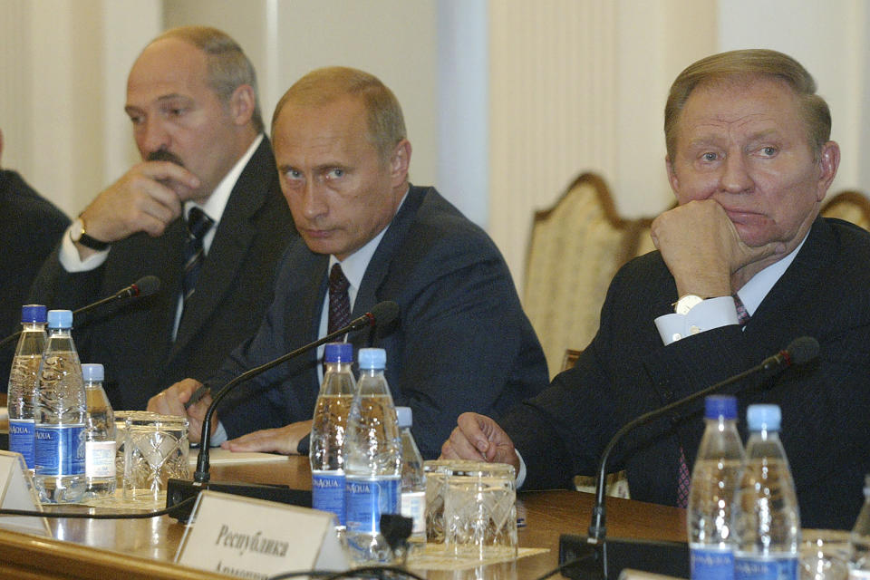 FILE - Presidents, right to left, Leonid Kuchma of Ukraine, Vladimir Putin of Russia, and Alexander Lukashenko of Belarus during a press conference after the Commonwealth of Independent States meeting at the Black Sea resort of Yalta, Ukraine, on Sept. 19, 2003. Russia's present demands are based on Putin's purported long sense of grievance and his rejection of Ukraine and Belarus as truly separate, sovereign countries but rather as part of a Russian linguistic and Orthodox motherland. (AP Photo/ Efrem Lukatsky, Pool, File)