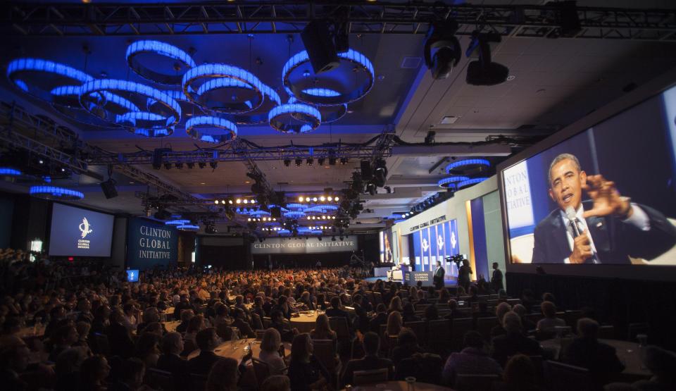 U.S. President Obama is seen on a large monitor as he speaks during the Clinton Global Initiative 2013 (CGI) in New York