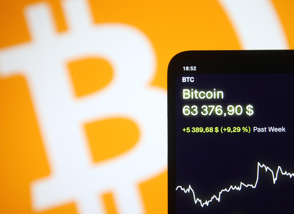 Bitcoin virtual cryptocurrency price is displayed on a phone screen in this photo taken on April 13, 2021 in Kyiv, Ukraine. Bitcoin cryptocurrency a surge of over 60,000 $ US dollars, as media reported on April 13, 2021 in Kyiv, Ukraine. (Photo Illustration by STR/NurPhoto via Getty Images)