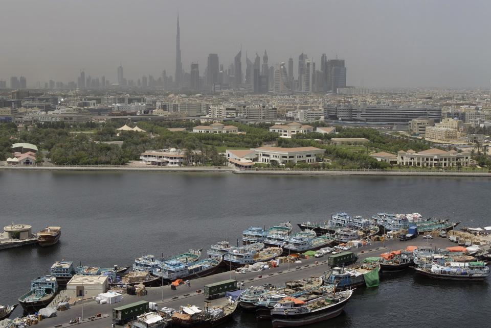 This Sunday, June 10, 2012 photo shows the skyline with world's tallest building, Burj Khalifain in Dubai, United Arab Emirates. (AP Photo/Kamran Jebreili)