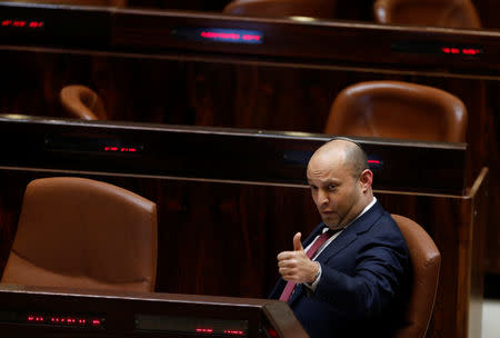 Israeli Education Minister Naftali Bennett gestures during a vote on a bill at the Knesset, the Israeli parliament, in Jerusalem February 6, 2017. REUTERS/Ammar Awad