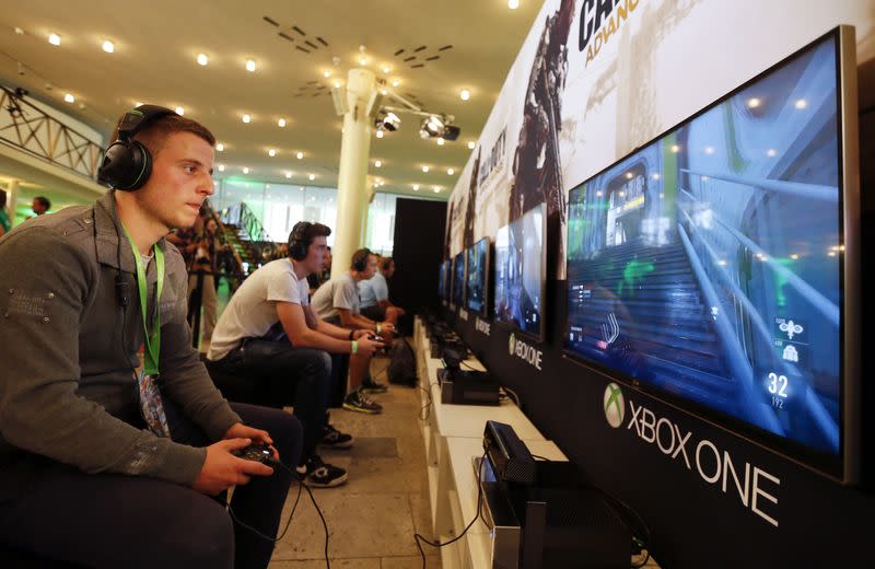 FILE PHOTO: A gamer plays "Call of Duty: Advanced Warfare" on an Xbox One console during the Xbox Play Day 2014, before the Gamescom 2014 fair in Cologne