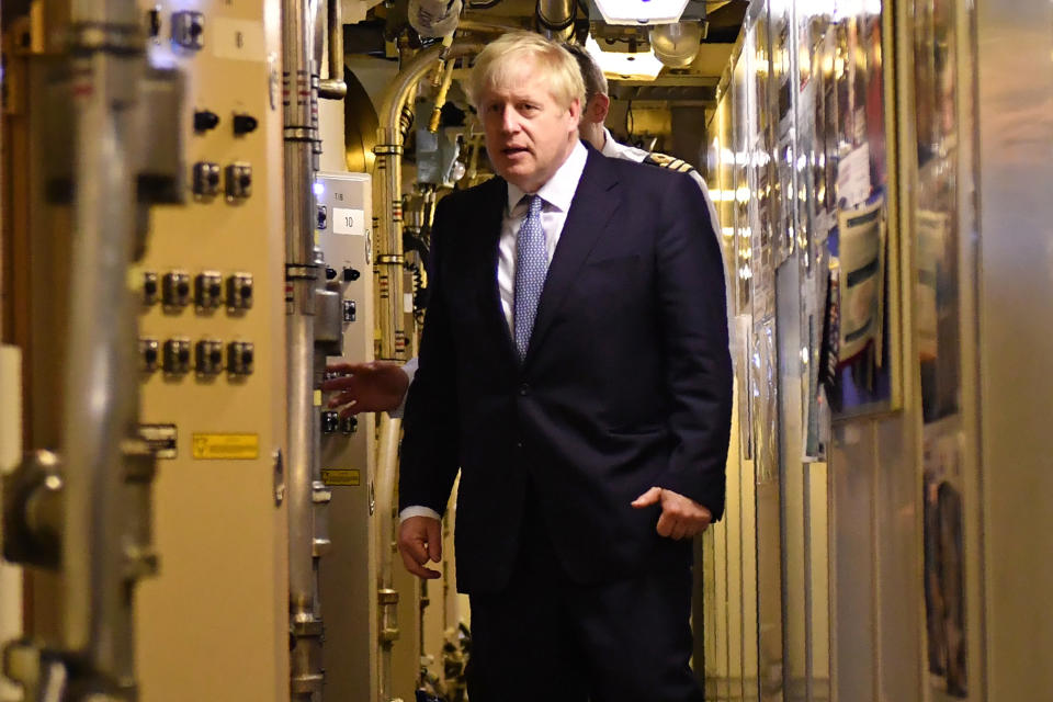 Britain's Prime Minister Boris Johnson aboard Vanguard-class submarine HMS Victorious during a visit to Faslane Naval base (HM Naval Base Clyde), north of Glasgow in Scotland on July 29, 2019. - New British Prime Minister Boris Johnson makes his first official visit to Scotland on Monday in an attempt to bolster the union in the face of warnings over a no-deal Brexit. (Photo by Jeff J Mitchell / POOL / AFP) / The erroneous mention[s] appearing in the metadata of this photo by Jeff J Mitchell has been modified in AFP systems in the following manner: [HMS Victorious] instead of [HMS Vengeance]. Please immediately remove the erroneous mention[s] from all your online services and delete it (them) from your servers. If you have been authorized by AFP to distribute it (them) to third parties, please ensure that the same actions are carried out by them. Failure to promptly comply with these instructions will entail liability on your part for any continued or post notification usage. Therefore we thank you very much for all your attention and prompt action. We are sorry for the inconvenience this notification may cause and remain at your disposal for any further information you may require.        (Photo credit should read JEFF J MITCHELL/AFP/Getty Images)