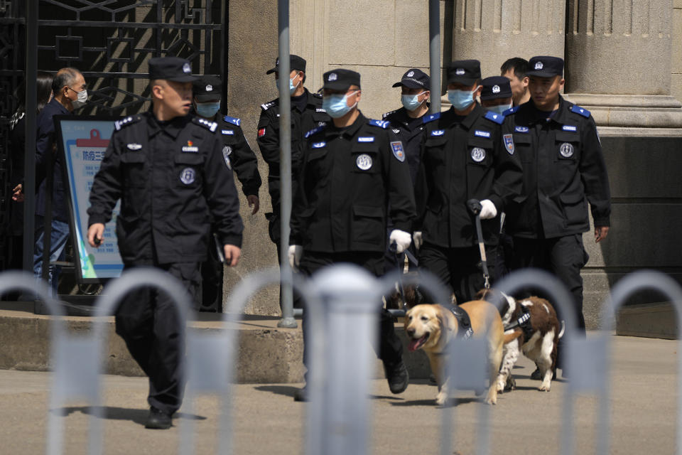 Security officers patrol outside the Nanjing Presidential Palace ahead of a visit by former Taiwan President Ma Ying-jeou, in Nanjing, in eastern China's Jiangsu province, Tuesday, March 28, 2023. Ma has departed for a tour of China in what he calls an attempt to reduce tensions a day after Taiwan lost one of its few remaining diplomatic partners to China. (AP Photo/Ng Han Guan)