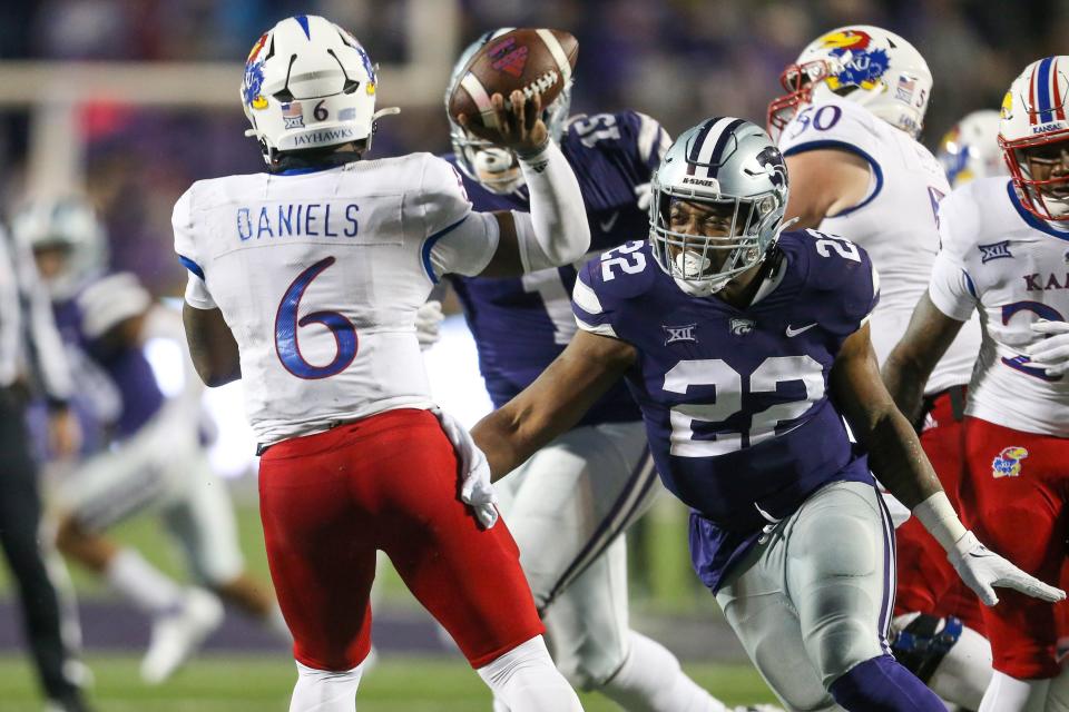 Kansas State middle linebacker Daniel Green (22) pressures Kansas quarterback Jalon Daniels (6) during last year's Sunflower Showdown at Bill Snyder Family Stadium.