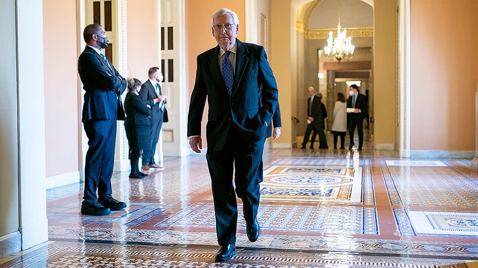 Minority Leader Mitch McConnell (R-Ky.) heads to the Senate Chamber on Wednesday, January 12, 2022.