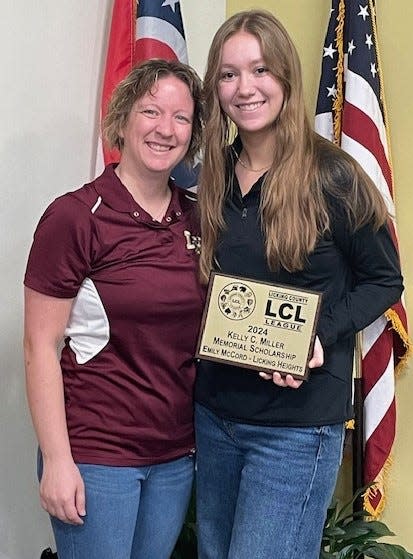 Licking Heights senior Emily McCord is presented the Licking County League Kelly C. Miller Memorial Scholarship by athletic director Ellie Geiger.