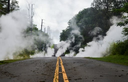 Steam rises from a fissure on a road in on Hawaii's Big Island