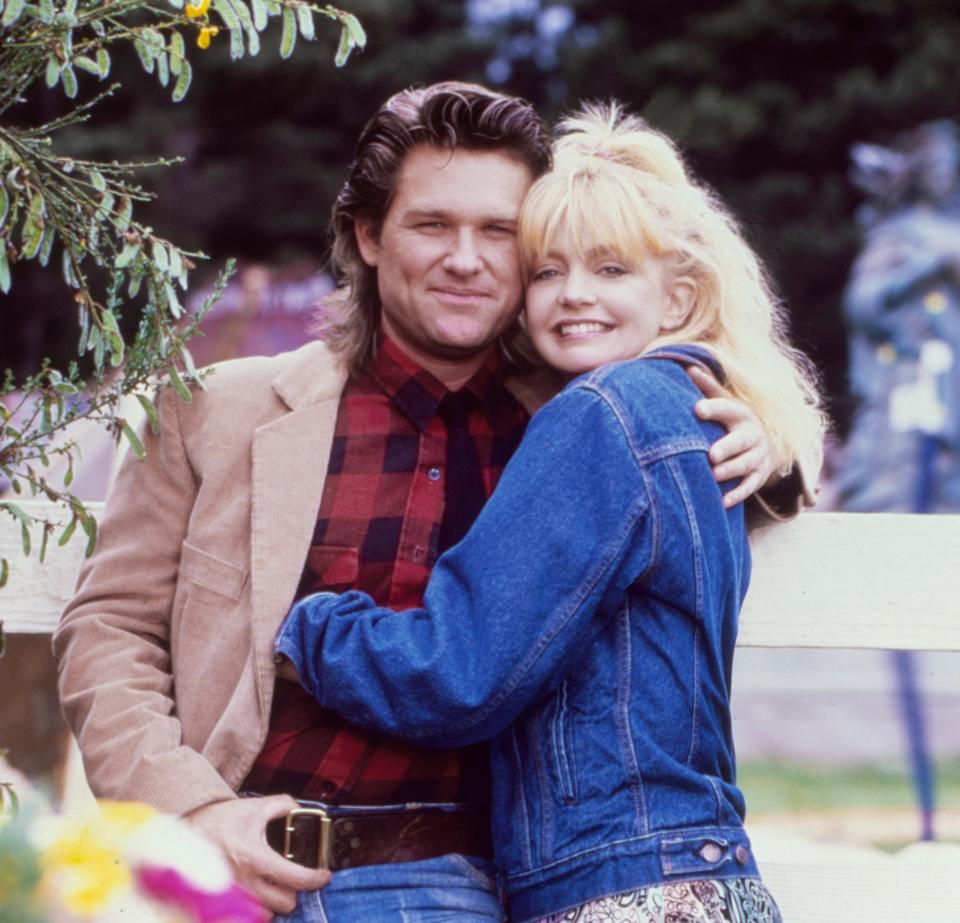 Goldie Hawn and Kurt Russell pose for a portrait while shooting the movie "Overboard" (1987).