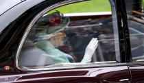 Britain's Queen Elizabeth II arrives by car during day five of of the Royal Ascot horserace meeting, at Ascot Racecourse, in Ascot, England, Saturday June 19, 2021. (Andrew Matthews/PA via AP)