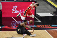 New Orleans Pelicans guard Lonzo Ball (2) jumps to avoid Memphis Grizzlies center Xavier Tillman in the second half of an NBA basketball game Monday, May 10, 2021, in Memphis, Tenn. (AP Photo/Brandon Dill)