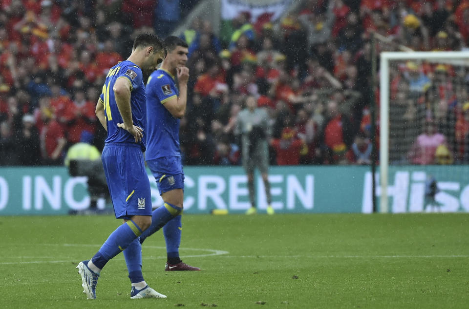 Ukraine players react after Wales' Gareth Bale scored his side's opening goal during the World Cup 2022 qualifying play-off soccer match between Wales and Ukraine at Cardiff City Stadium, in Cardiff, Wales, Sunday, June 5, 2022. (AP Photo/Rui Vieira)