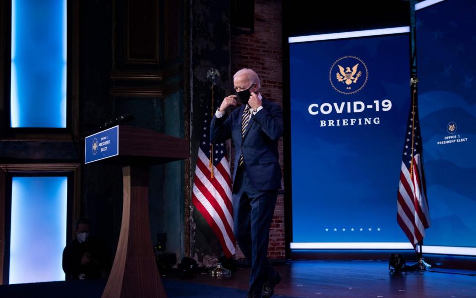 Joe Biden arrives to speak at the Queen Theater after a COVID-19 briefing he held December 29, 2020, in Wilmington, Delaware - AFP