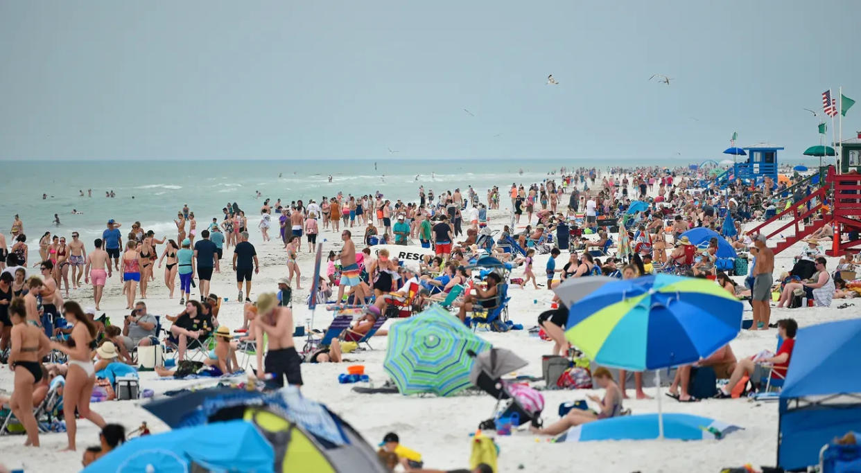 An estimated 8,000 people cover the white quartz sand at Siesta Key Beach in March 2022.