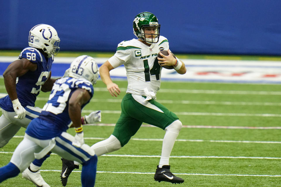 New York Jets quarterback Sam Darnold (14) is chased out of the pocket by Indianapolis Colts inside linebacker Bobby Okereke (58) and defensive back Kenny Moore II (23) in the second half of an NFL football game in Indianapolis, Sunday, Sept. 27, 2020. (AP Photo/AJ Mast)