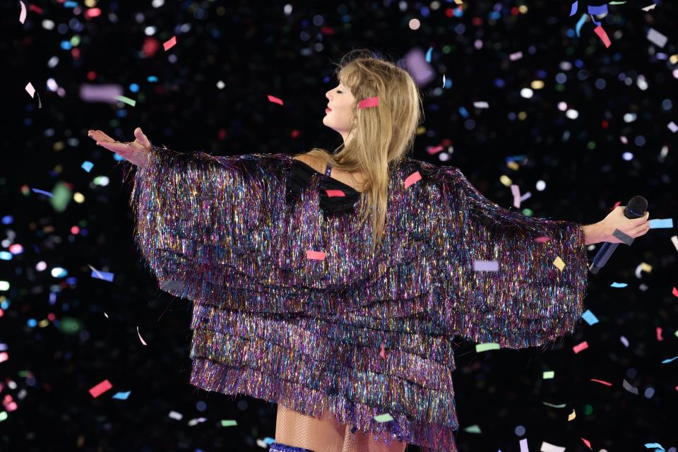 image of Taylor Swift surrounded by confetti at concert