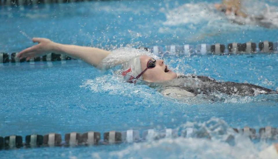 In a February 2018 file photo, South Mecklenburg High School’s Sinclair Larson competes in the women’s 100-yard backstroke at the NCHSAA 4A Swimming Championships in Cary.